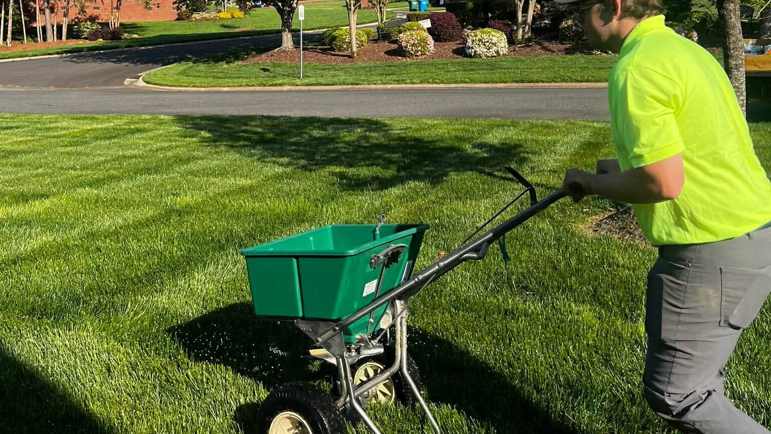 A team member working in a lawn